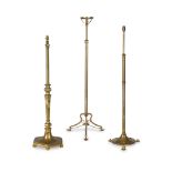 Three 20th century brass standard lamps (3)