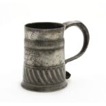 An extremely rare and fine Queen Anne pewter gadrooned mug, ale-pint capacity, circa 1705