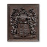 A 19th century carved walnut coat of arms