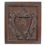 A 19th century carved oak armorial panel, English