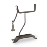 An unusual 19th century wrought iron table rushnip and candle-holder