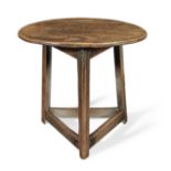 A small George III elm cricket table, circa 1800