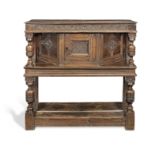 A rare and documented Commonwealth joined oak canted livery cupboard, Cumbria, dated 1658