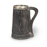 An 18th century white-metal mounted leather mug or tankard, English