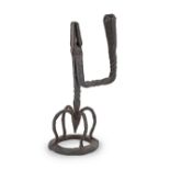 A large late 18th/early 19th century wrought iron table rushnip and candle-holder, Irish