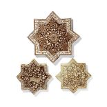 Three Qajar 'Kashan style' lustre pottery star tiles Persia, 19th Century(3)