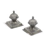 A pair of silver-inlaid alloy bidri carpet weights Deccan, 19th Century(2)