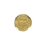 An Umayyad Gold Dinar from the reign of 'Abd al-Malik (AD 685-705) probably Damascus, dated AH 77...