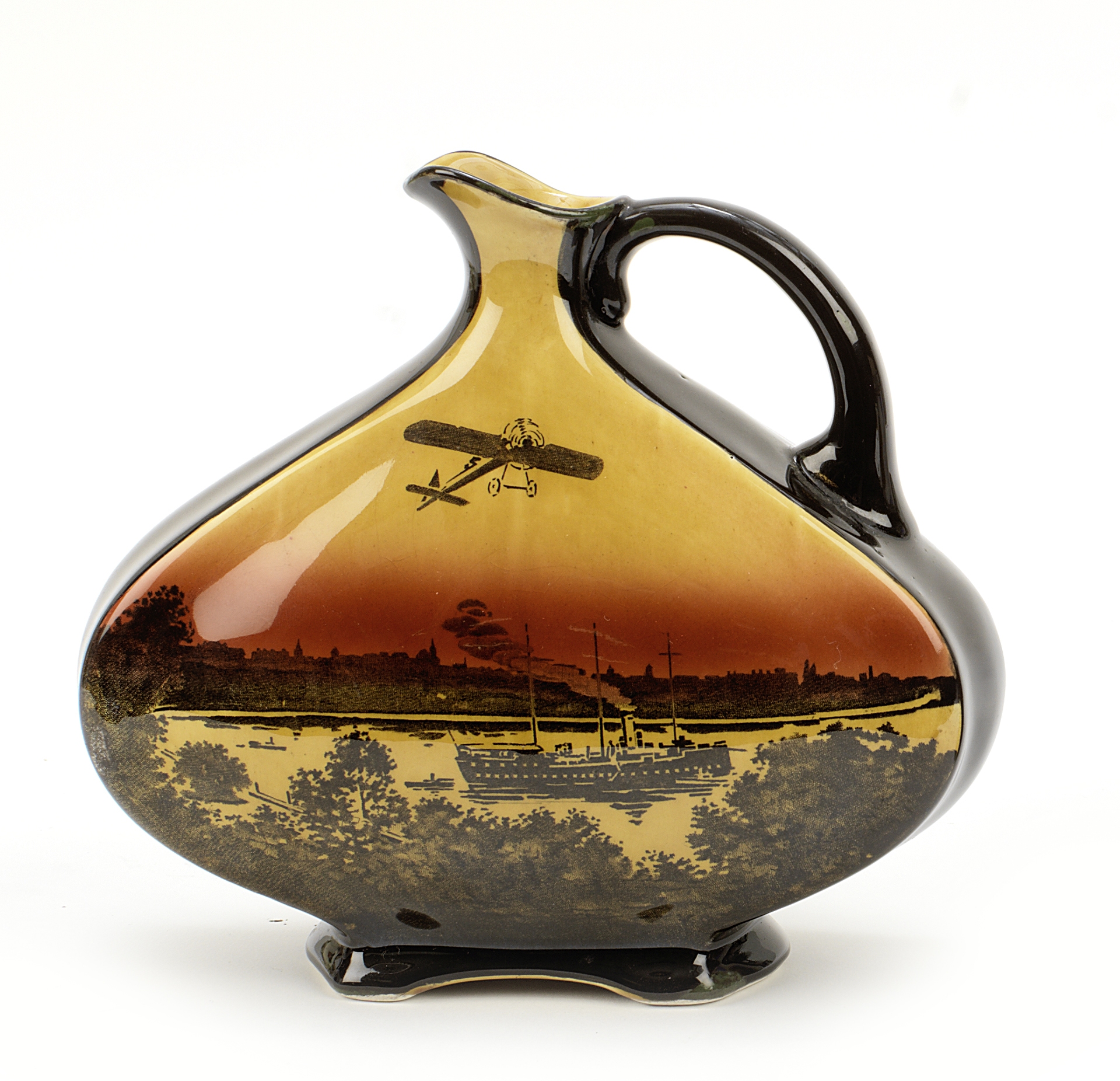 A rare Dewar's 'Bleriot Monoplane over Sydney Harbour' water jug by Royal Doulton, registered des...