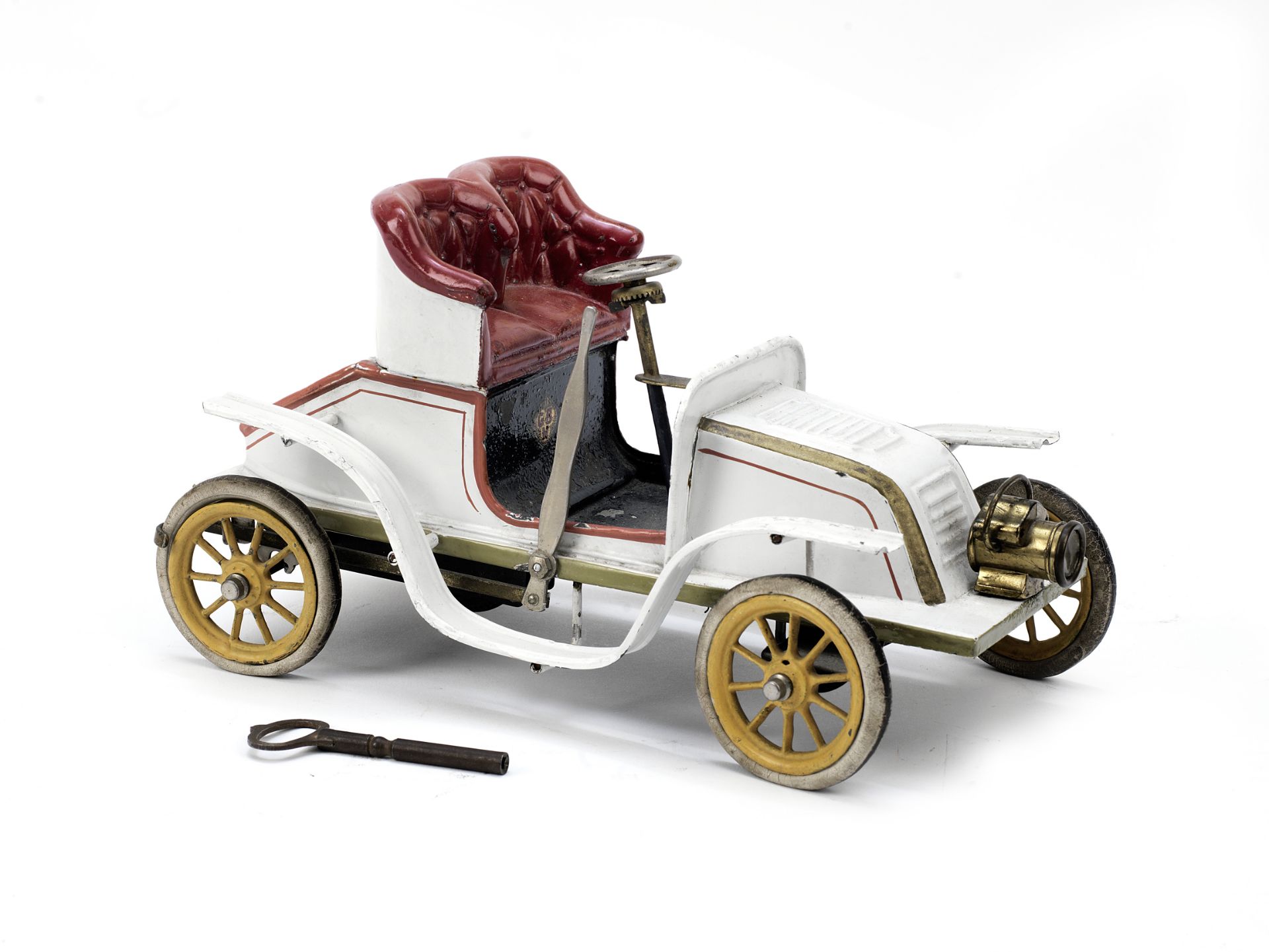 A fine and rare clockwork tin-plate toy of a De Dion 'Runabout' by Bing, German, circa 1904, ((2))