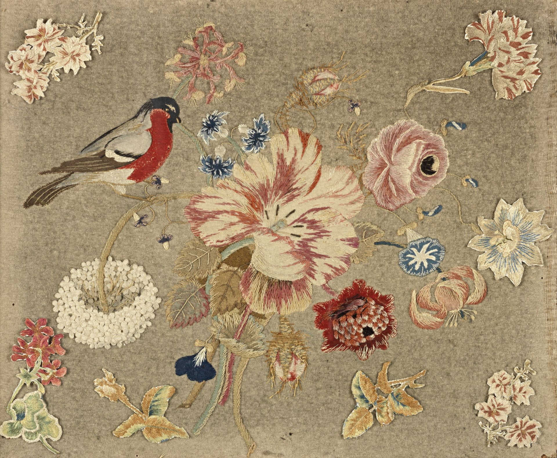 A silk and wool embroidered and appliqued felt panel depicting a bull finch and a floral bouquet ...