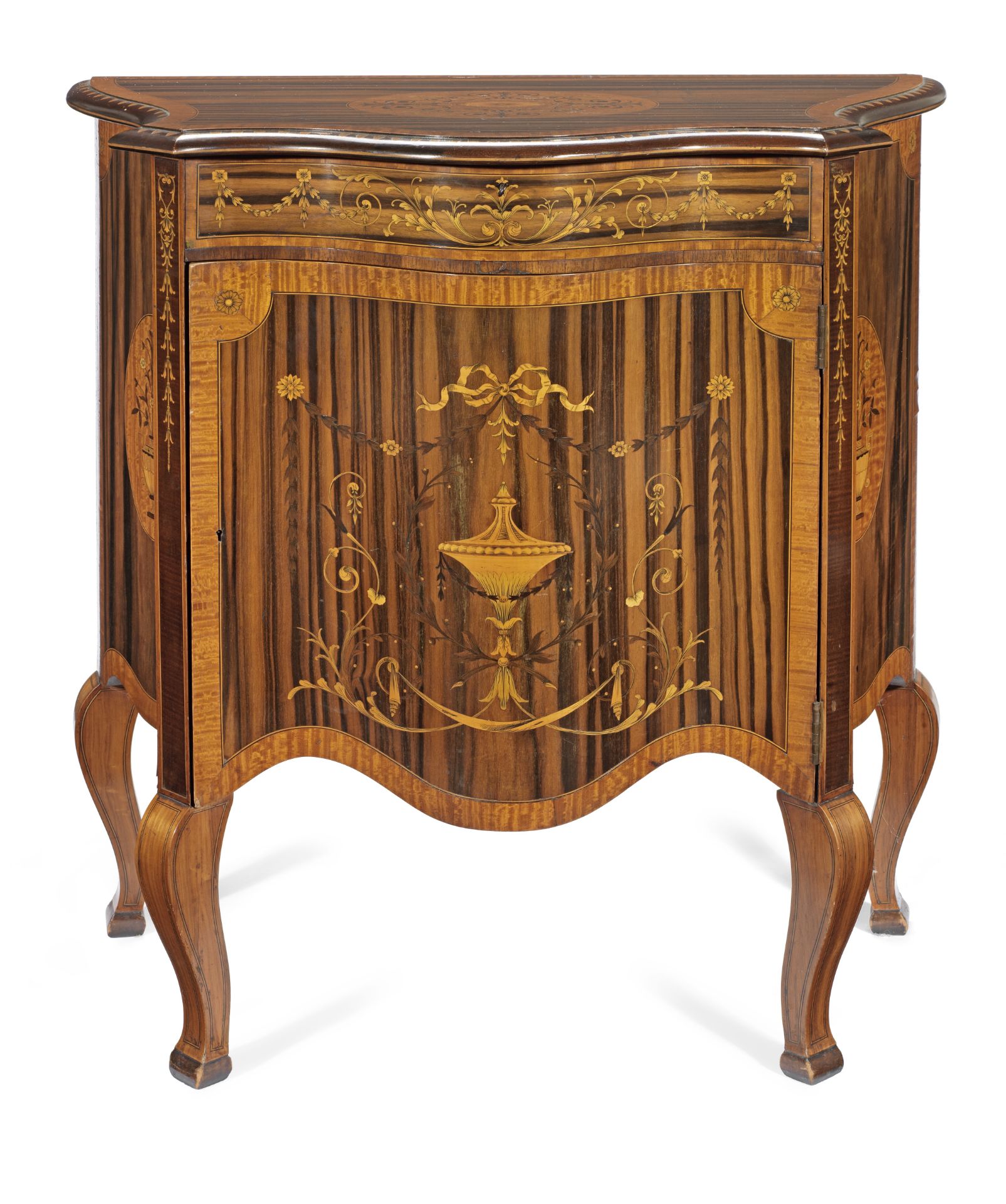 A late Victorian zebrawood, satinwood, purplewood and marquetry serpentine commode