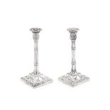 A matched pair of silver tapersticks one John Carter II, London 1770, the other Walter Morrisse,...