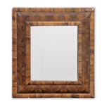 A William and Mary olivewood, oyster veneered 'cushion frame' mirror