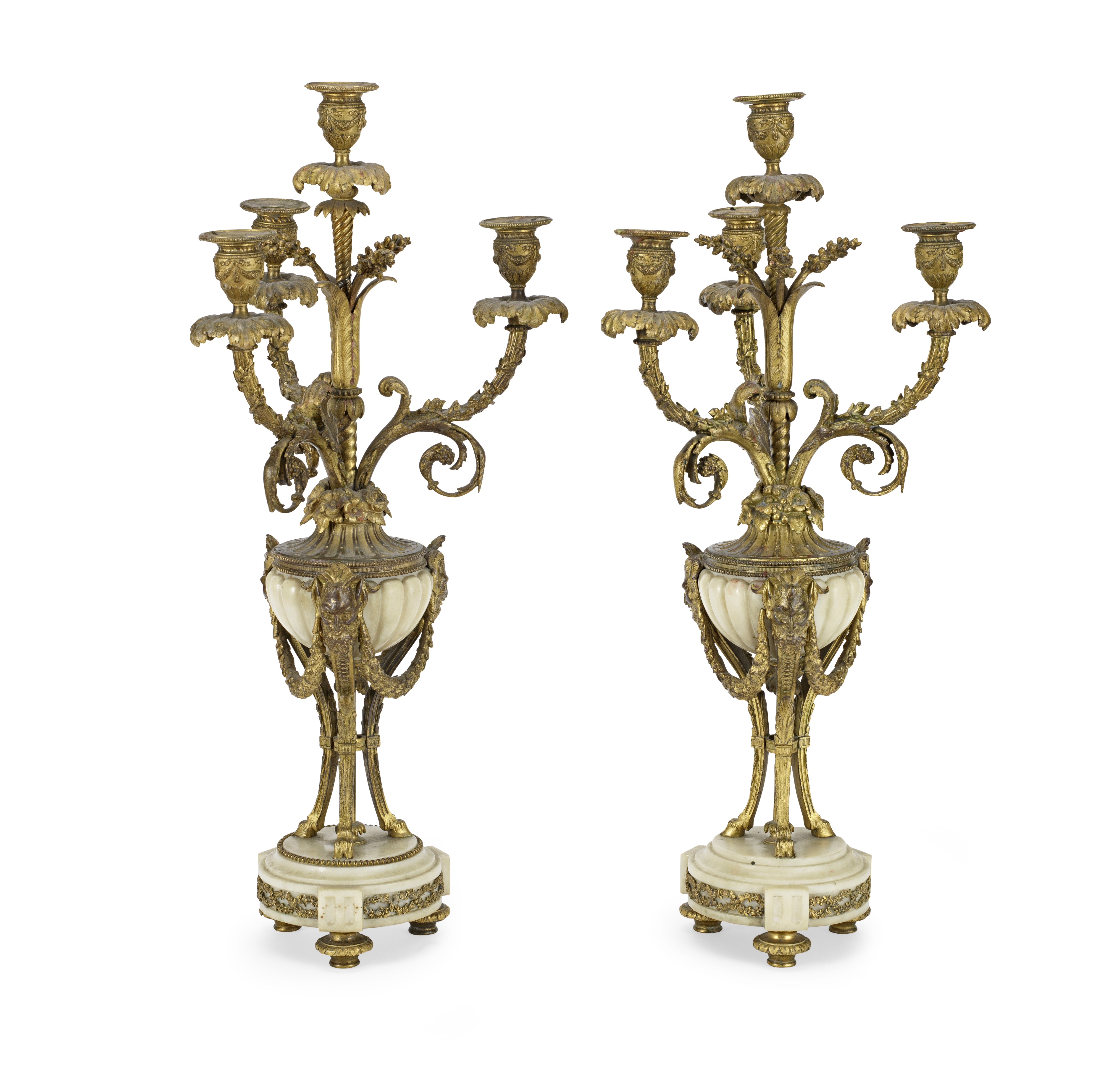 A pair of late 19th century French gilt bronze and white marble four light garniture candelabra i...