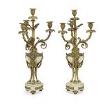 A pair of late 19th century French gilt bronze and white marble four light garniture candelabra i...