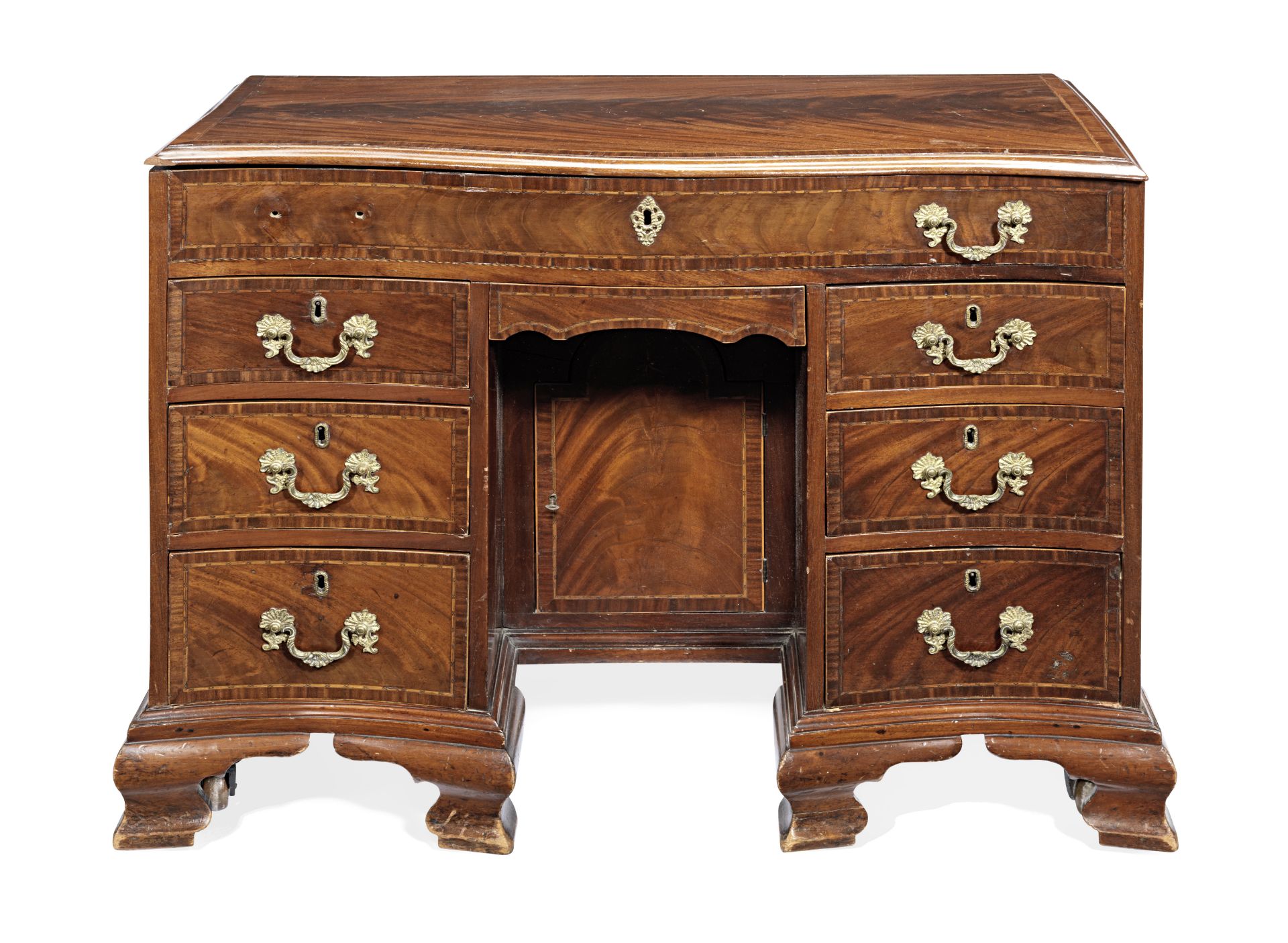A George III mahogany and chequer inlaid serpentine kneehole writing/dressing table