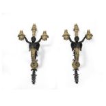 A pair of 19th century gilt and patinated bronze figural three light wall appliques in the Restau...