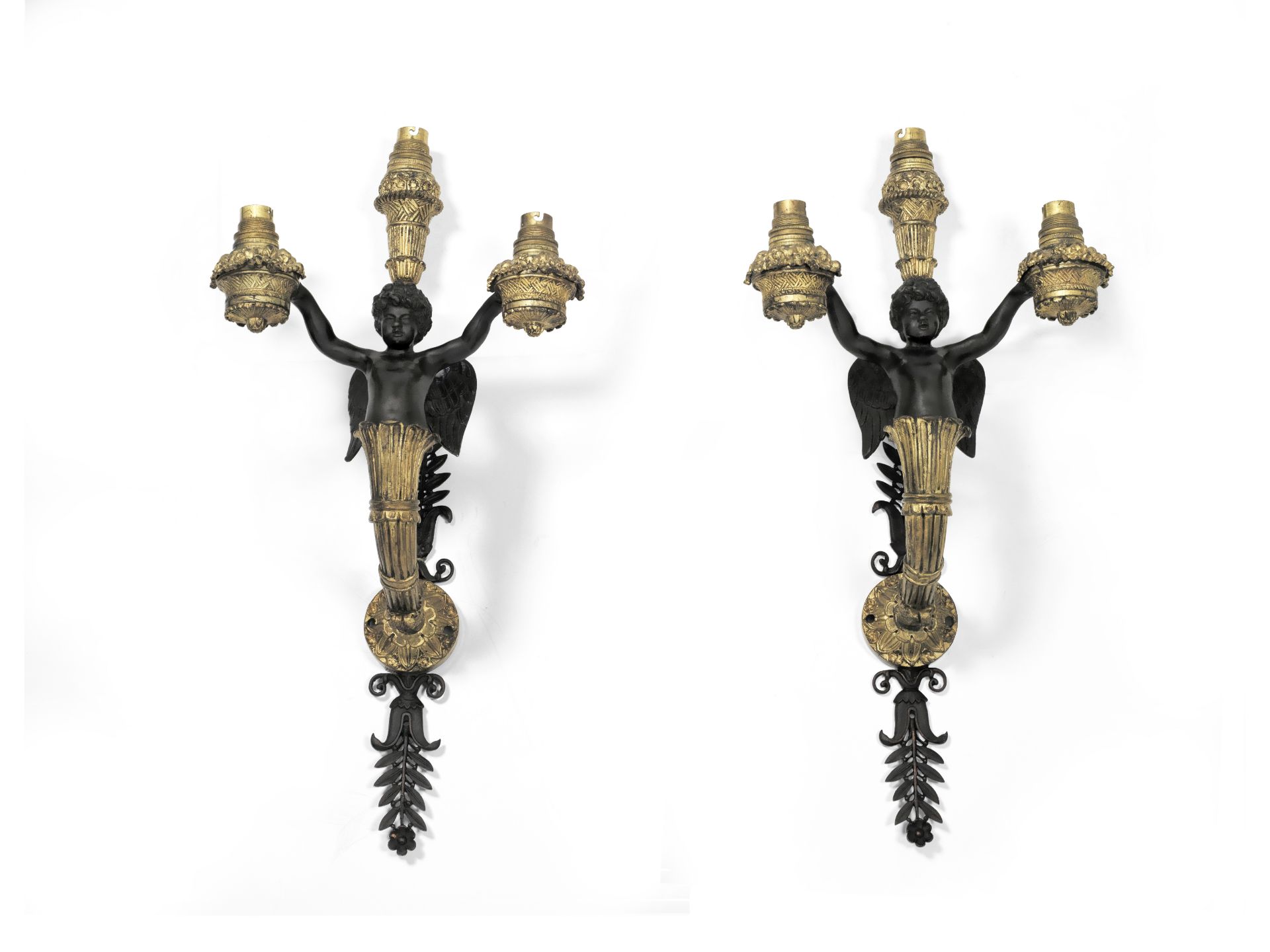 A pair of 19th century gilt and patinated bronze figural three light wall appliques in the Restau...