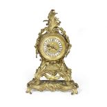 A late 19th century French gilt bronze mantel clock in the Louis XV style, the dial signed Raingo...