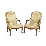 A pair of 18th century French provincial Louis XV solid walnut fauteuils (2)
