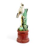 A late 19th century Majolica glazed earthenware stork stick stand and pedestal in the Minton style