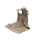 Frans Xaver Bergman (Austria, 1861-1936): A cold painted bronze figure of a middle eastern carpet...