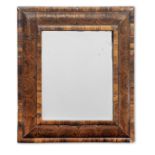 A William and Mary olivewood, oyster veneered 'cushion frame' mirror