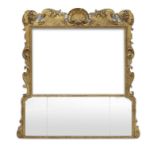 A George II giltwood and gilt gesso overmantel trumeau mirror lacking a picture within the upper ...