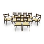 A set of eleven Regency ebonised, decorated and parcel gilt dining chairs (11)