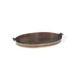 A George III mahogany and brass bound oval tray