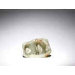 A pale green and russet jade grotto group Qing Dynasty