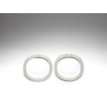 A pair of white jade 'dragon' bangles 18th/19th century (2)