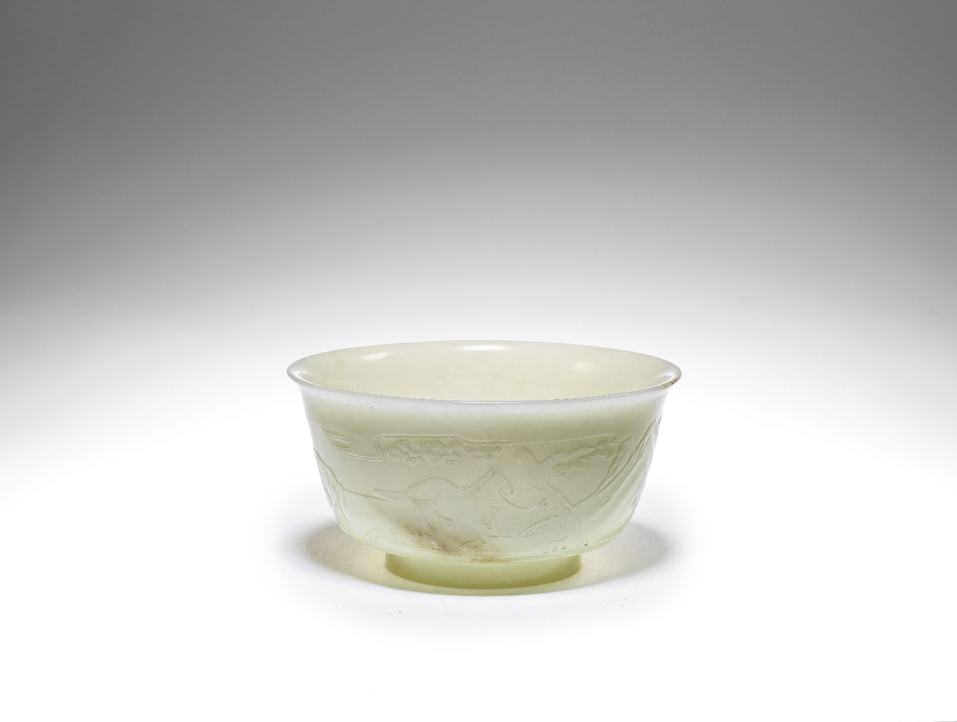 A pale green jade 'horses' bowl