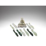 A small collection of jade belt hooks and a jade figure of Buddha Qing Dynasty (12)