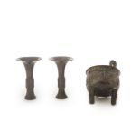 A pair of archaistic beaker vases, gu, and an archaistic incense burner, ding The ding, Song/Ming...