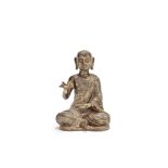 A gilt-copper alloy figure of a Monk
