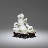 A white jade figure of a lady and two rams (2)