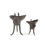 Two archaistic bronze wine vessels, jue The first, dated Kangxi 25th year (corresponding to AD168...