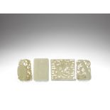 A group of four various white and pale green jade pendants Qing Dynasty (4)