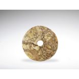 A Neolithic style jade disc, bi