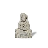 A schist figure of Maitreya Ancient region of Gandhara, circa 3rd/4th century 38cm (15in) high.
