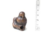 A wood netsuke of an owl 19th century