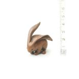 A wood netsuke of a long-eared rabbit Attributed to Ranko, 19th century