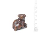 A boxwood netsuke of a dog 19th century