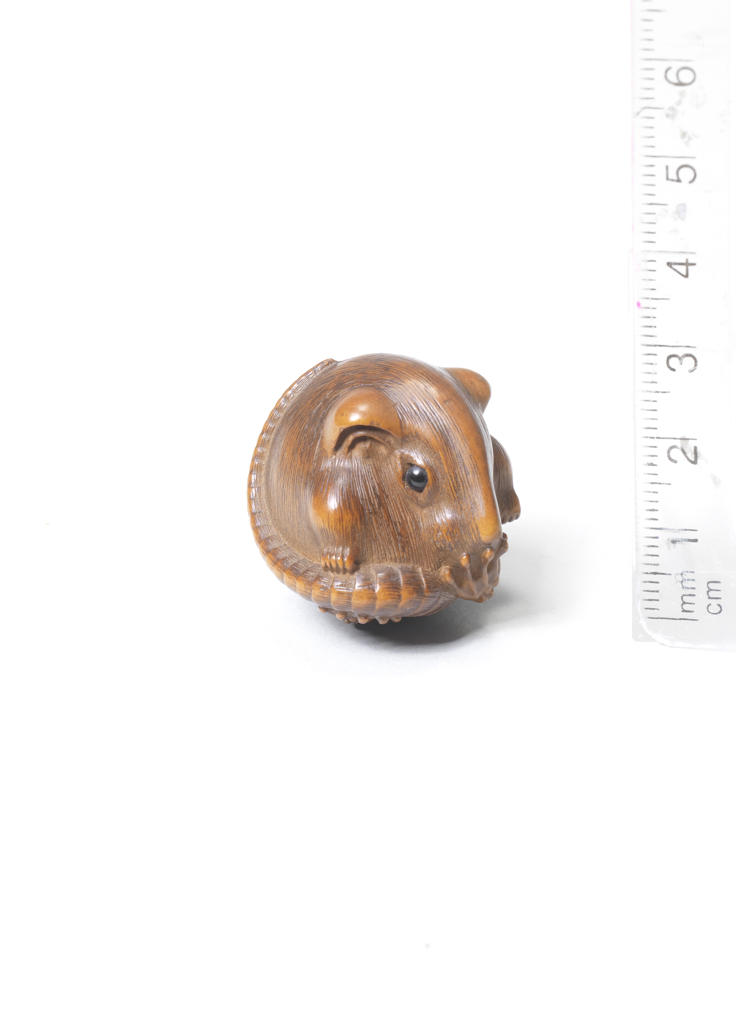 A wood netsuke of a rat By Masakazu, 19th century