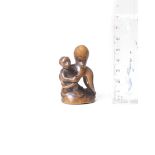 A wood netsuke of a monkey and octopus By Tanaka Minko (1735-1816), Tsu, Ise Province, late 18th...