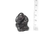 A wood netsuke of a monkey School of Kano Tomokazu, Gifu, 19th century