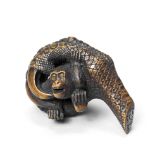 A wood netsuke of a monkey in an eagle's claw By Ryumin, 19th century