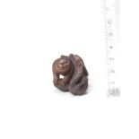 A wood netsuke of a tiger and dragon By Masatsugu, late 19th century